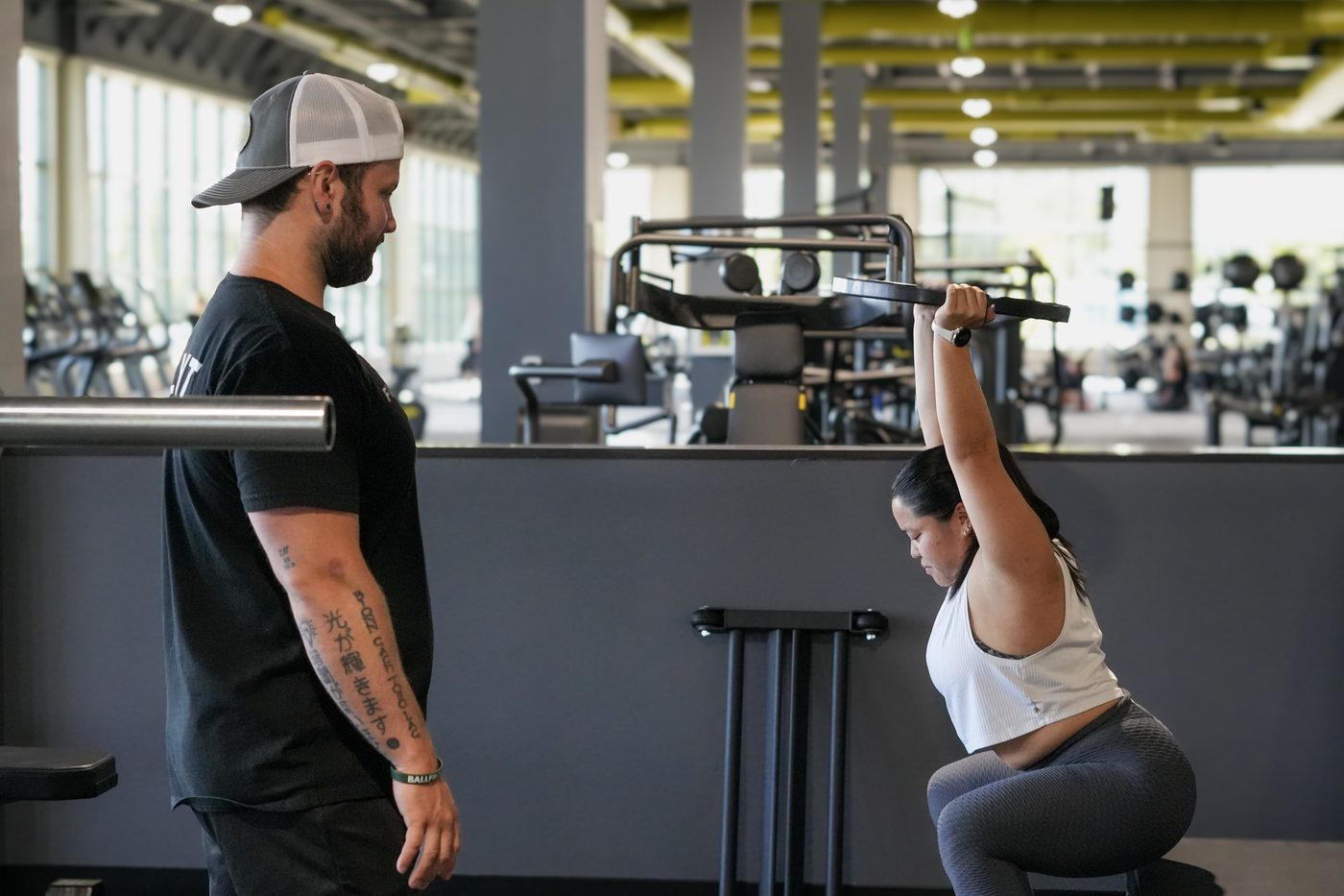A coach working one-to-one with a member at Flight House Rye\